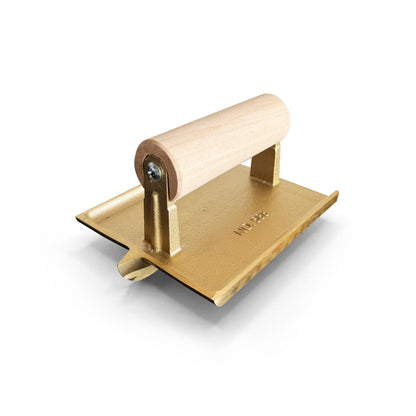 Bronze groover with wooden handle on a white background